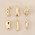 Macro detail of 18K gold plated vegetable charms including peanut and chili pendants - Gold Peanut (PJ0201)