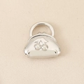 Detailed macro view of 18K gold-plated purse pendant with embossed cherry pattern design - Silver (PJ0585)