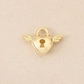 Detailed close-up of a 18K gold plated heart lock pendant with wings for jewelry making - Gold