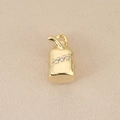 Macro shot of 18K gold plated juice box pendant with sparkling zircon stone accents - Gold