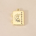 Detail van 18K vergulde boekhanger met zon en maan reliëf en micro-ingelegde steentjes - Goud