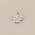 Macro view of 18K gold-plated silver paw print pendant with clear heart-shaped crystals - Silver