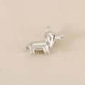 Detailed view of silver dachshund dog pendant with sparkling zircon on high-quality metal - Silver