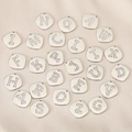 Macro view of 26 alphabet letter charms with silver plating and inlaid zircons on satin - Letter A / Rounded Square Pave Style (PJ0004) / Silver