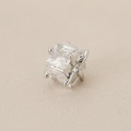 Macro view of 18K gold plated square zircon charm with classic four-prong setting detail - Silver