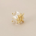 Macro detail of 18K gold plated cube bead with four-claw set cubic zirconia stones - Gold