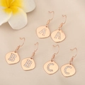 Close-up of three pairs of rose gold alphabet earrings with crystal A, B, C charms - Letter Y (PJ0224) / Rose Gold