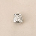 Detailed close-up of a silver lucky money bag charm with ancient coin relief and ring - Silver