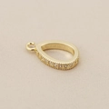 Detail view of 18K gold-plated teardrop pendant with micro-pave cubic zirconia crystals - Gold