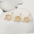 Macro view of 18k gold plated DIY earring studs with S925 hallmark and white stones - Gold