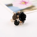 Close-up of resin rose cocktail ring with black gemstones and sparkling rhinestones - Black