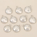 Close-up of 10 silver plated round pendants with micro-paved zircons for DIY jewelry - Silver Round Style (Style 2)