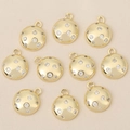 Detailed macro view of 18k gold plated round pendants with sparkly zircon stones - Gold Round Style (Style 2)