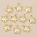 Close-up of ten 18k gold-plated star pendants with sparkling cubic zirconia for DIY jewelry - Gold Star Style (Style 3)