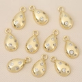 Detailed macro view of 10 gold-plated teardrop charms with zircon inlays for DIY jewelry - Gold Water Drop Style (Style 5)