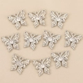 Vue détaillée de 10 pendentifs papillon argentés avec zircon rond sur tissu de soie - Argent Style 1