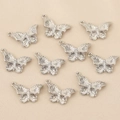 Détail de pendentifs papillon plaqués or 18k et ornés de pierres en zircon brillant - Argent Style 4