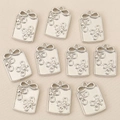 Detailed view of silver flower charms with decorative bows for DIY jewelry making - Silver Style 1
