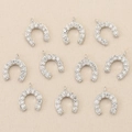 Macro shot of 10 silver U-shaped horseshoe charms with CZ micro-pave for DIY jewelry - Horseshoe / Silver Style 1