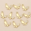 Detailed view of ten gold-plated butterfly charms with white zircon inlay for jewelry making - Gold Butterfly Style