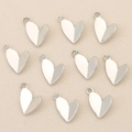 Close-up of heart-shaped 18k gold plated jewelry pendants for DIY necklace making - Silver Heart Shape