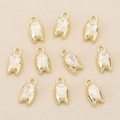 Detailed view of 18k gold plated tulip pendants with sparkling pear cut zircons - Gold Simple Bud Style