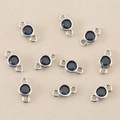 Macro detail of ten silver-plated double-loop connectors with deep blue round zircons - Silver Royal Blue