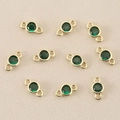 Detailed view of ten 18k gold plated round green zircon double hole connectors for DIY jewelry - 3mm / Gold Green