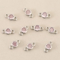 Close-up of silver-plated copper connectors with pink zircons for DIY jewelry making - Silver Pink
