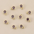 Macro view of ten purple faceted zircon charms with 18k gold-plated frames for DIY jewelry - 3mm / Gold Purple
