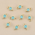 Detailed macro view of 18k gold plated double-loop sky blue birthstone jewelry connectors - 3mm / Gold Sky Blue