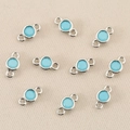 Detail view of 10 silver-plated round connectors with light blue zircons for DIY jewelry - Silver Turquoise