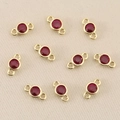 Macro detail of 18k gold plated round red zircon connectors for jewelry making - 3mm / Gold Red