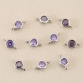 Macro shot of ten purple round zircon pendants with 18k gold-plated silver connectors - Silver Purple