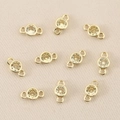Close-up of 10 gold plated 18k copper connectors with champagne zircon for jewelry DIY - Gold Yellow