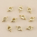 Macro view of 18k gold-plated double-loop jewelry connectors with sparkling zircons - Gold Yellow