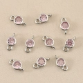Detail of pink birthstone connectors with double rings and silver-plated metal bases - Silver Pink