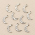 Close-up of nine 18k gold plated crescent moon charms with sparkling cubic zirconia stones - Silver Crescent Moon Shape (Style 8)