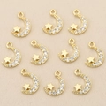 Close-up of ten 18k gold plated moon and star charms with sparkling cubic zirconia inlay - Gold Star & Moon Combination (Style 10)