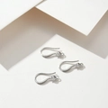 Macro shot of silver plated copper earring hooks with zircon and sparkling rhinestones - Earring Hooks / Silver