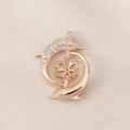 Macro shot of rose gold dolphin pendant with pave stones and pearl peg for DIY jewelry - Rose Gold