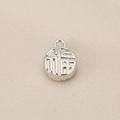 Detailed macro view of silver Chinese Fu character pendant with embossed relief design - Silver