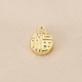 Macro detail of 18K gold-plated round pendant with embossed Fu character for DIY jewelry - Gold