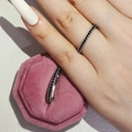 Minimalist silver eternity ring featuring micro-paved black stones and pink velvet box - Black