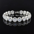Elegant silver zircon tennis bracelet with oval stones and halo design on black surface - Oval Halo Ring Style (s7190) / Silver