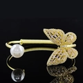 Elegant gold butterfly bracelet featuring a white pearl and pink gemstone accents - Pink Gold Butterfly Pearl Style
