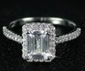 Elegant emerald cut silver ring with halo diamonds and side stones setting - US 5 / White
