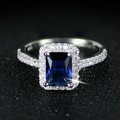 Women's silver-colored ring with a rectangular deep blue gemstone and halo stones - US 5 / Blue