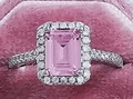 Silver ring with rectangle pink gemstone and halo diamonds in a velvet jewelry box - Pink