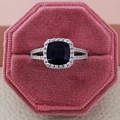 Luxury square cushion cut dark blue gemstone ring with halo diamonds in a pink box - Size 5 / Blue